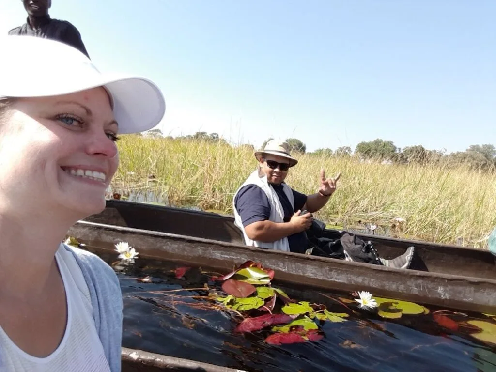 Francis McKay and a tourist taking a canoe selfie on a Namibian river