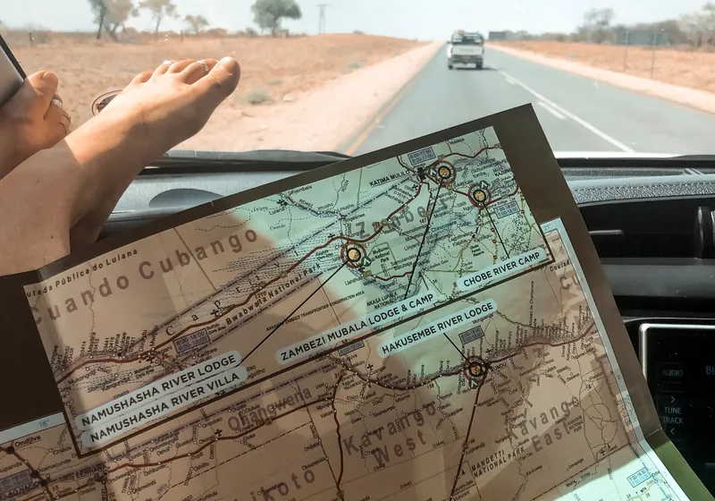 Self-drive vehicle on a Namibian gravel road through open wilderness