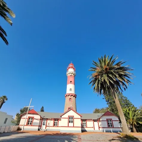The Swakopmund Lighthouse, a 28-metre red-and-white tower that has guided ships past the Skeleton Coast since 1902